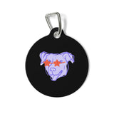 A round black pet ID tag with a silver metal carabiner clip, featuring a stylized purple dog face wearing red star-shaped sunglasses on a white background.custom pet ID tag, personalized dog tag, personalized cat tag, custom dog collar tag, pet identification tag, metal pet tag, dog ID tag, cat ID tag, custom pet tag, pet collar tag, personalized pet accessory