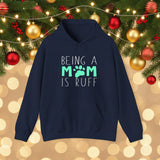 Navy blue hoodie with 'Being a Mom is Ruff' text on a background with orange leaves.