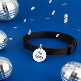 Black dog collar with a 'Kitty' tag on a blue background with disco balls